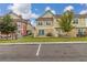 Rear view of townhome with private patio and lawn at 7585 Sunny Dreams Ln, Kissimmee, FL 34747