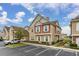 Two-story townhouse boasts attractive exterior with a landscaped walkway at 7585 Sunny Dreams Ln, Kissimmee, FL 34747