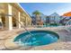 Community hot tub with surrounding lounge chairs at 7585 Sunny Dreams Ln, Kissimmee, FL 34747
