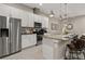 Modern kitchen featuring stainless steel appliances and granite countertops at 7585 Sunny Dreams Ln, Kissimmee, FL 34747