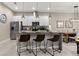 Modern kitchen with island, stainless steel appliances, and granite countertops at 7585 Sunny Dreams Ln, Kissimmee, FL 34747