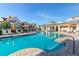Relaxing community pool with surrounding lounge chairs at 7585 Sunny Dreams Ln, Kissimmee, FL 34747