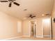 Large bedroom with two ceiling fans and carpet flooring at 7845 Wandering Way, Orlando, FL 32836