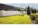 Landscaped backyard with privacy fence and lush lawn at 7845 Wandering Way, Orlando, FL 32836