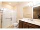 Bathroom with single vanity and walk-in shower at 7845 Wandering Way, Orlando, FL 32836