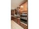 Kitchen with double oven and custom cabinetry at 7845 Wandering Way, Orlando, FL 32836