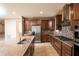 Modern kitchen with island and stainless steel appliances at 7845 Wandering Way, Orlando, FL 32836