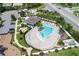 Resort-style pool with lounge chairs and a covered patio area at 7845 Wandering Way, Orlando, FL 32836