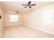 Spacious bedroom with neutral walls and carpeting at 7845 Wandering Way, Orlando, FL 32836
