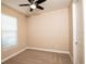 Well-lit bedroom with ceiling fan and window blinds at 7845 Wandering Way, Orlando, FL 32836