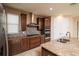 Modern kitchen featuring stainless steel appliances and granite countertops at 7845 Wandering Way, Orlando, FL 32836