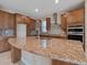 Modern kitchen with granite countertops and stainless steel appliances at 7845 Wandering Way, Orlando, FL 32836