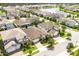 Aerial view of a residential neighborhood with a lake at 7845 Wandering Way, Orlando, FL 32836
