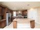 Spacious kitchen with granite countertops, stainless steel appliances, and ample cabinetry at 7845 Wandering Way, Orlando, FL 32836