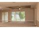Large living room with sliding doors to backyard at 7845 Wandering Way, Orlando, FL 32836