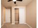 Bright bedroom with ceiling fan, carpet, and spacious closet at 7845 Wandering Way, Orlando, FL 32836