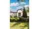 Front view of a single-story house with green landscaping at 7845 Wandering Way, Orlando, FL 32836