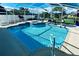 Inviting pool and spa with screened enclosure, lounge chairs, and patio furniture at 1779 Lisa Ln, Kissimmee, FL 34744