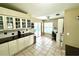 Updated kitchen with glass-front cabinets and access to the patio at 1779 Lisa Ln, Kissimmee, FL 34744