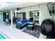 Spacious covered patio with seating, grill, and outdoor storage at 1779 Lisa Ln, Kissimmee, FL 34744