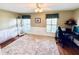 Spacious home office with large windows, wood floors, and plenty of natural light at 1779 Lisa Ln, Kissimmee, FL 34744
