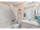 Clean bathroom with a shower/tub combo and updated vanity at 247 Travis Ln, Davenport, FL 33837