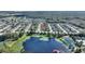 Aerial view of home located on a lake within a community at 247 Travis Ln, Davenport, FL 33837