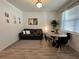 Living room features gray couch, round dining table, and patterned rug at 2971 Camden Way, Davenport, FL 33837