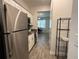 Modern kitchen with stainless steel appliances and gray countertops at 2971 Camden Way, Davenport, FL 33837