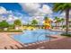 Resort-style pool with water slide and ample lounge space at 2971 Camden Way, Davenport, FL 33837