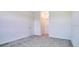 Spacious bedroom with carpet flooring and access to a hallway at 2971 Camden Way, Davenport, FL 33837