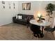 Living room features gray couch, round dining table, and patterned rug at 2971 Camden Way, Davenport, FL 33837