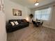 Living room features gray couch, round dining table, and patterned rug at 2971 Camden Way, Davenport, FL 33837