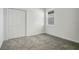 Empty bedroom with carpet and double door closet at 2971 Camden Way, Davenport, FL 33837