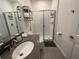 Clean bathroom, featuring a walk-in shower and gray vanity at 2971 Camden Way, Davenport, FL 33837