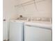 Laundry room with washer, dryer, and shelving at 2971 Camden Way, Davenport, FL 33837