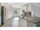 Modern kitchen featuring stainless steel appliances and dark countertops at 2971 Camden Way, Davenport, FL 33837