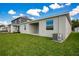 Spacious backyard with covered patio and AC unit at 2971 Camden Way, Davenport, FL 33837