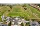 View of the community golf course and clubhouse at 2971 Camden Way, Davenport, FL 33837