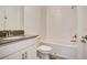Clean bathroom with white vanity, tub, and tile flooring at 2971 Camden Way, Davenport, FL 33837