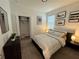Bedroom with a bed, nightstands, and modern wall art at 2971 Camden Way, Davenport, FL 33837
