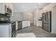 Well-equipped kitchen with stainless steel appliances and white cabinets at 2971 Camden Way, Davenport, FL 33837