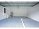 Garage with light gray floor at 2971 Camden Way, Davenport, FL 33837