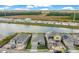 Aerial view of homes and lake in new community at 2971 Camden Way, Davenport, FL 33837