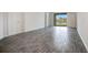 Bright living room with tile floors and sliding glass doors leading to a water view at 2971 Camden Way, Davenport, FL 33837