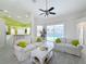 Bright living room with white sofas, pool view, and light wood floors at 3221 Bayview Ln, St Cloud, FL 34772