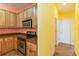 Kitchen with stainless steel appliances and light wood cabinets at 3401 Home Town Ln, St Cloud, FL 34769