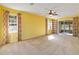 Bright living room with neutral walls, carpeting, and large windows at 3401 Home Town Ln, St Cloud, FL 34769
