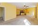 Open living area with view of kitchen and access to another room at 3401 Home Town Ln, St Cloud, FL 34769