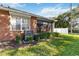 Brick home with screened porch, AC unit, and well-manicured lawn at 3401 Home Town Ln, St Cloud, FL 34769